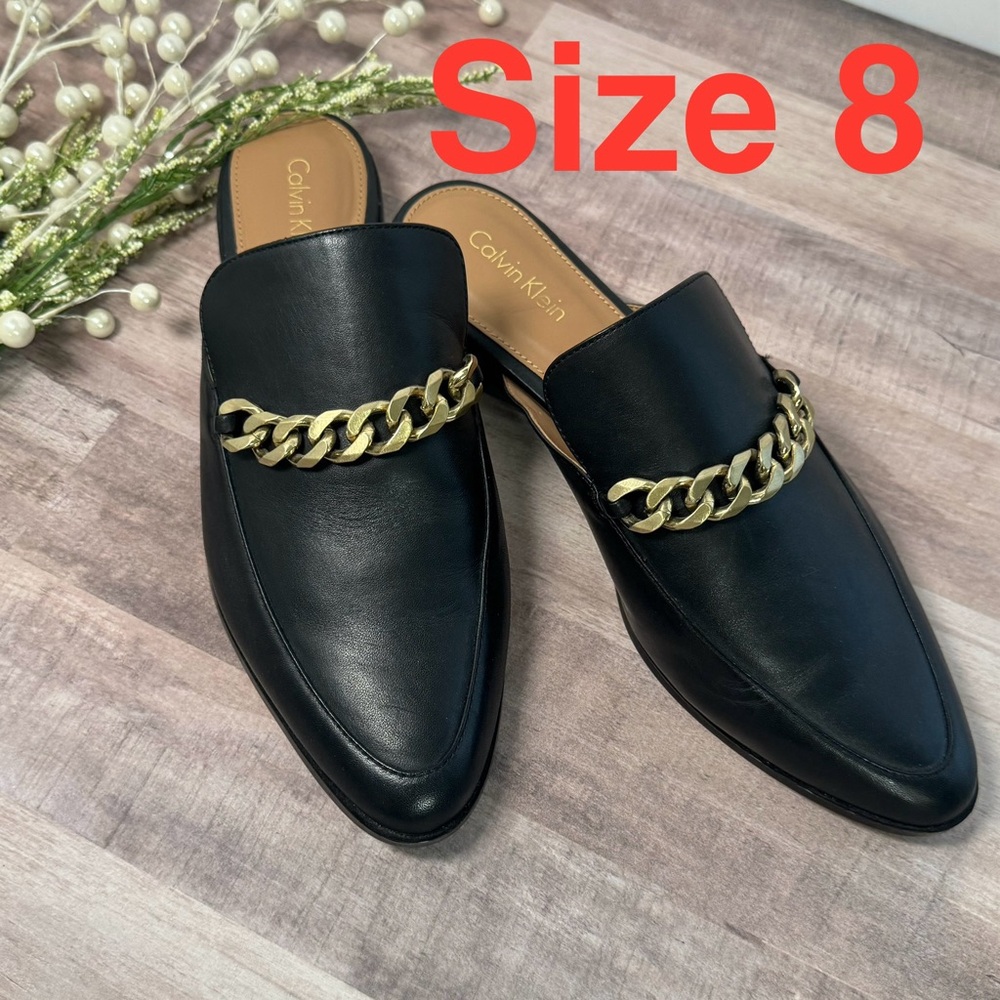 New Calvin Klein black leather slip on Frieda mules with gold chain, size 8